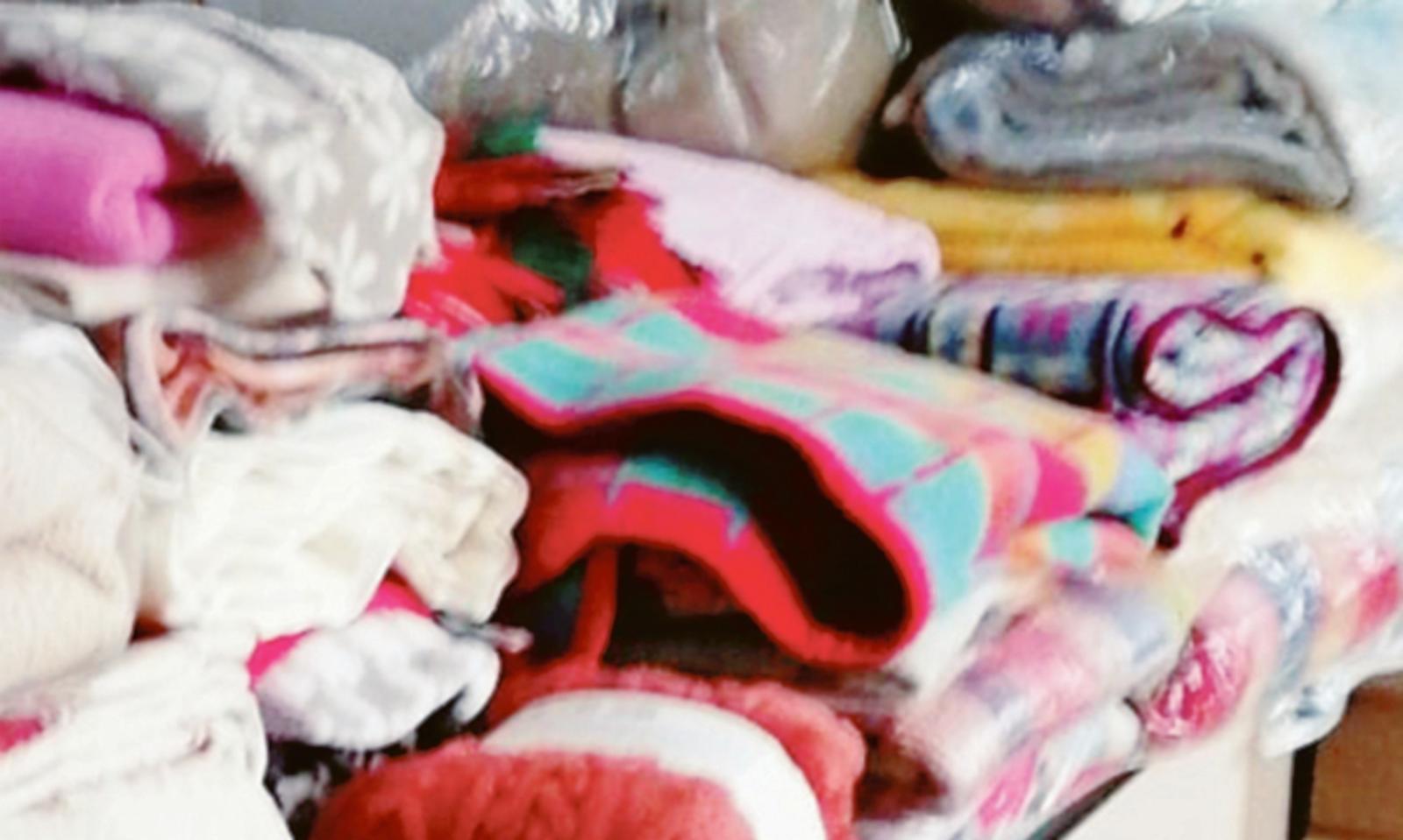 Coperte e abiti per chi non ha