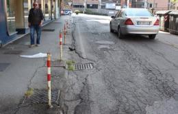 Via Portello, senza buche non è bello <br/> crateri, rattoppi e strisce a metà